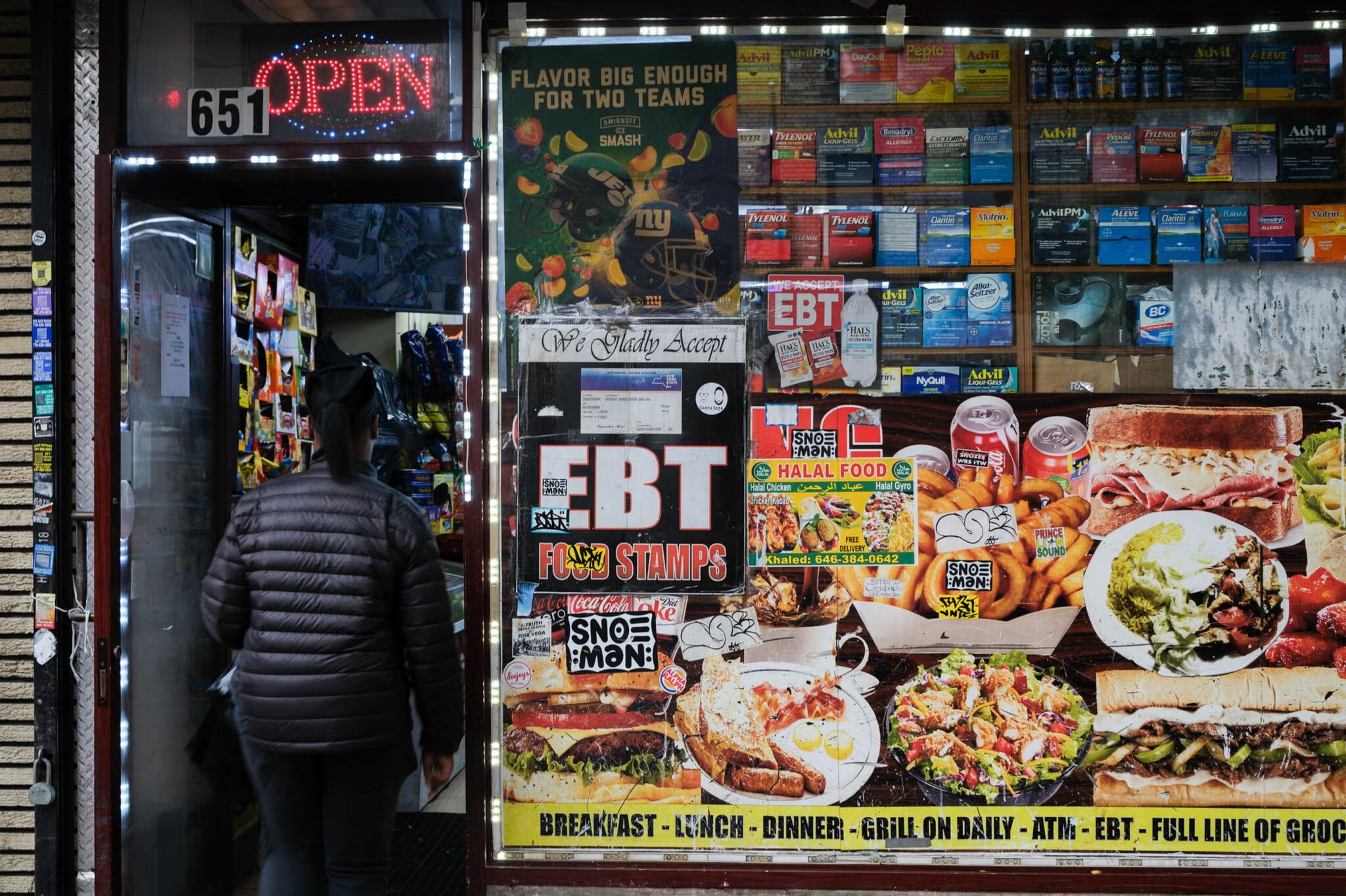 Woman walking into a store