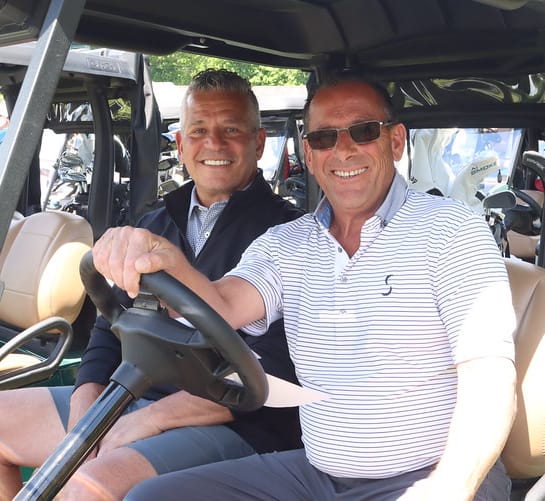 Golfers in golf cart