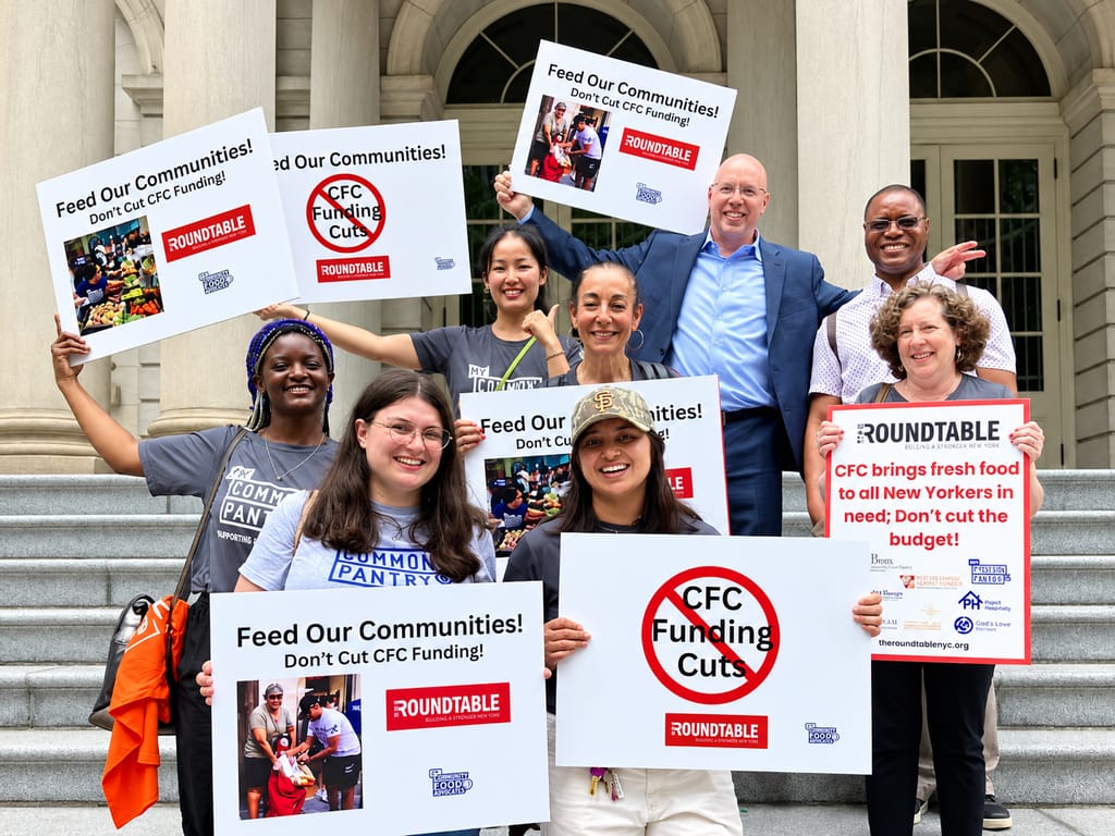 A group of people holding signs