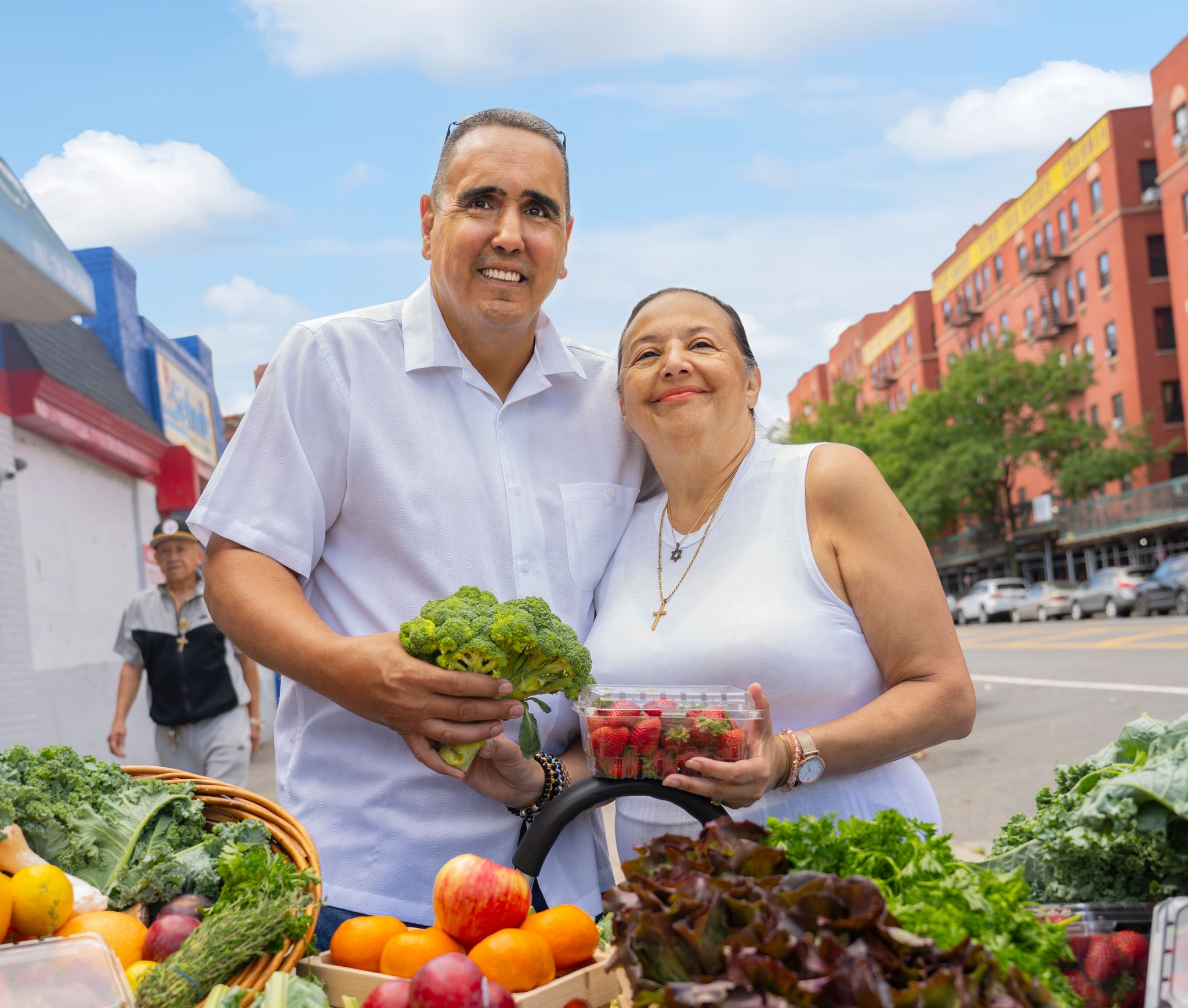 Couple in front of produce