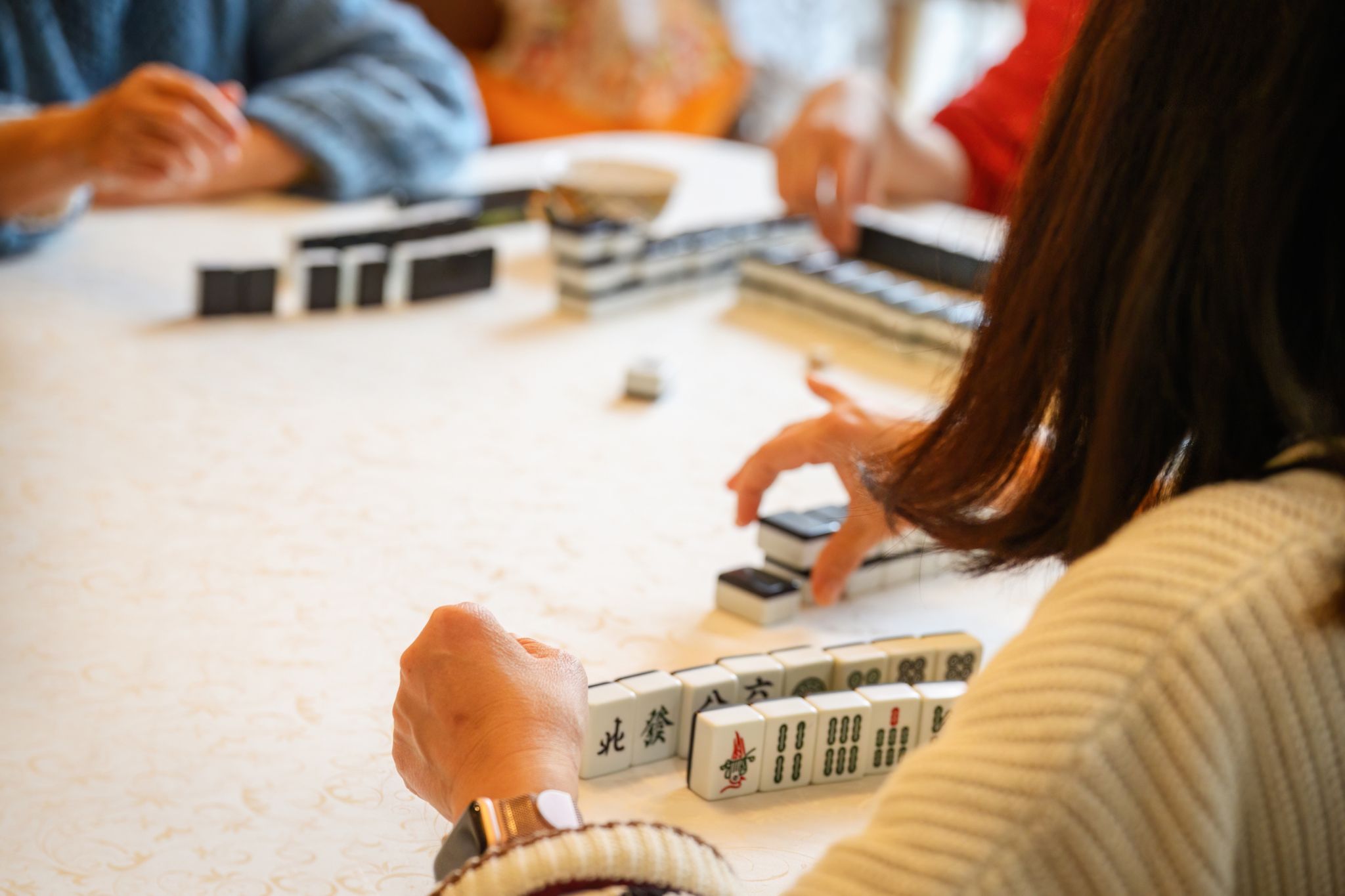People playing Mah Jongg