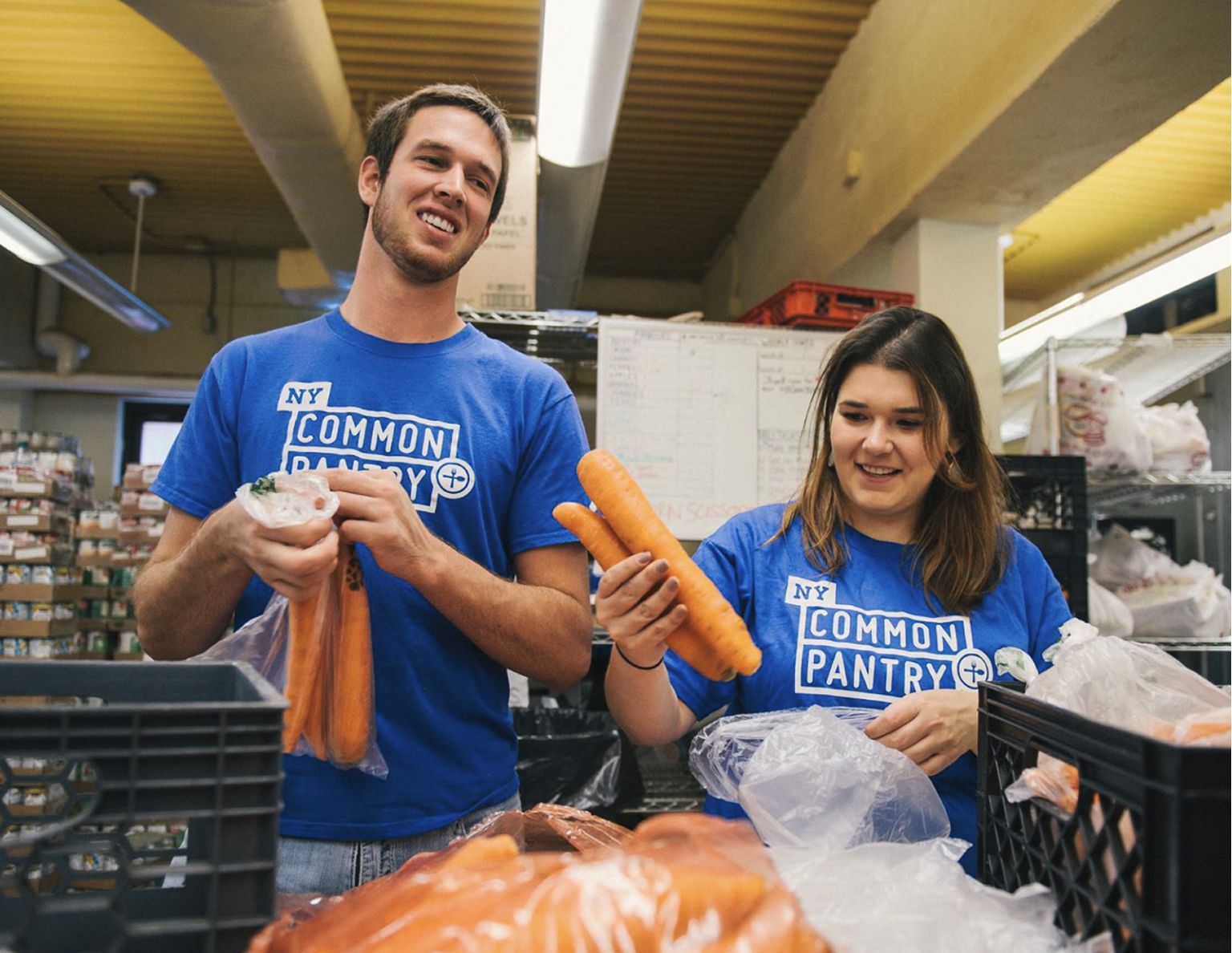 Volunteers packing carrots