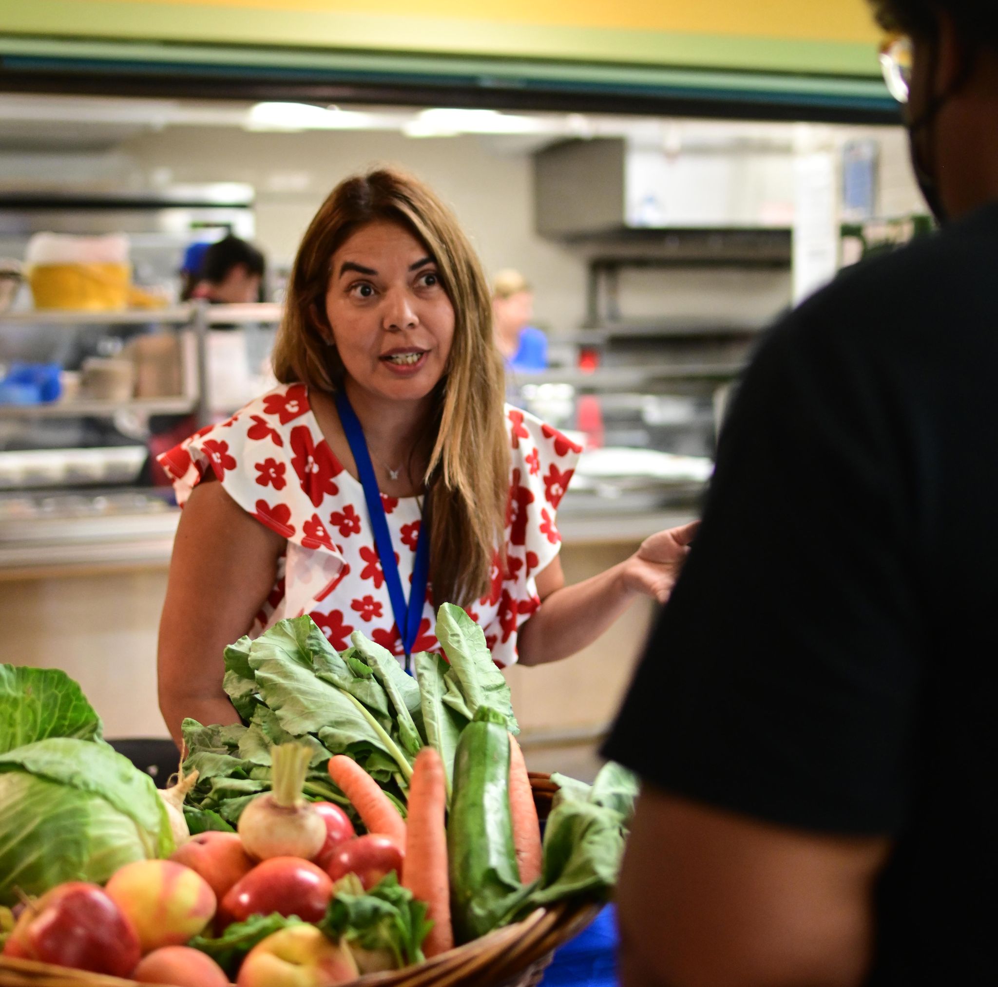 Woman speaking to farm share guest